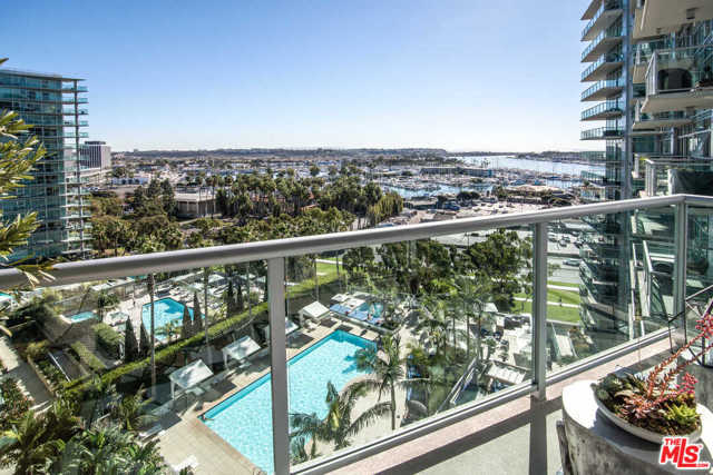 13700 Marina Pointe Drive 1229 Venice, California A must-see. This outstanding three bedroom, three-and-a-half bathroom with den boasts ocean, marina, and city views, enjoyed by two patios. Tastefully remodeled with no expenses spared, you enter the living room that is flooded with natural light. As the night falls and the marina lights twinkle in the background, enjoy some cozy time in front of the fireplace or prepare food in the open-air kitchen, which flows seamlessly into the dining and living room. The bonus den-office space allows the three bedrooms to be fully utilized by guests. Unparalleled amenities include a sun-drenched pool, outdoor gym, valet parking, and a rooftop terrace with epic views all around. Rare three non-tandem parking spaces included with an electric car charger. Conveniently located near restaurants, coffee shops, and groceries store for easy living, moments away from the water and bike paths. Southern California living at its finest.