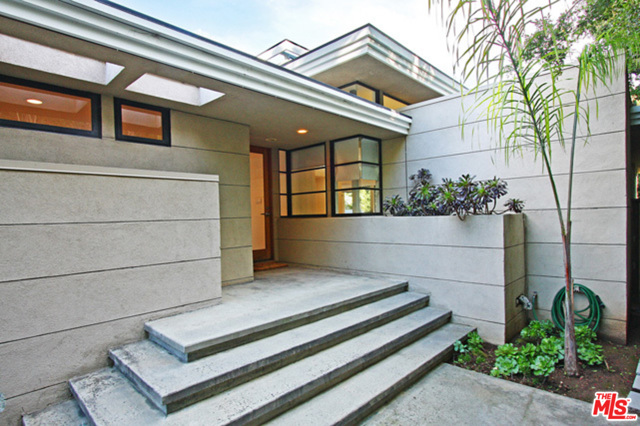 1104 VIA DE LA PAZ Pacific Palisades, California Gorgeous Mid-century located just a few steps from the Palisades village and the upcoming Rick Caruso shopping center, this fabulous modern architectural residence was built in 1989, has the ambiance of a 1960's Wright or Neutra. Great skylights, high ceilings, recessed lighting, beautiful stone fireplace in the great-room, mosaic tiles. Features include light infused foyer, modern kitchen, three bedrooms, the master suite offering access to the rear patio and a newly renovated bath which includes walk-in closets, built-in dressers, skylight, dual sinks. Come and enjoy all that Pacific Palisades have to offer, close to stores, restaurants and the beach.