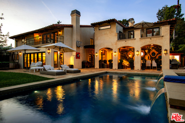 9790 Wendover Drive Beverly Hills, California Gated exquisite Mediterranean located in prime Benedict Hills Estates location. Dramatic double-height entry, open floorplan, custom chefs kitchen with eat-in nook and bar seating open to spacious family room all opening to large yard, covered living room loggia, pool and spa. Sumptuous master suite with his and her closets, exquisite bath and large deck with views of the pool and canyons. 2 kids suites, playroom /office and maids w/bath. Finest custom details, solid maple cabinetry and walnut floors throughout, Control 4 System, spacious 3 car garage, gated driveway. Top quality full-scale remodel with use of community tennis courts right across the street perfect for a busy family and for easy indoor/outdoor entertaining. Warner Ave. Elementary School.
