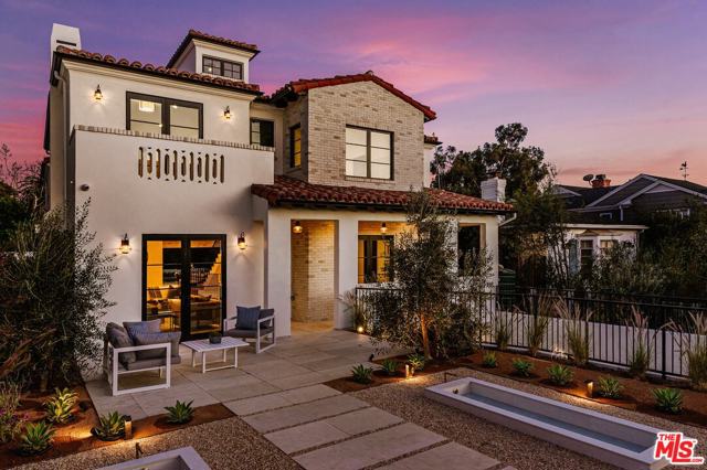 410 VIA DE LA PAZ Pacific Palisades, California This Stunning Modern Spanish was built in 2019 and is virtually brand new. Ideally located at the Via Bluffs and convenient to the Palisades Village, this 6 bed plus office and 9 bath home is nicely set above the street and exudes an understated elegance and offers all the modern amenities of luxury living. Features include an open concept plan with beautiful, wide plank wood floors, a gourmet kitchen and breakfast area, family room, movie theatre, built-in savant entertainment system, a gorgeous master suite, an upstairs family room, wine cellar, elevator and roof top deck. There is a grassy yard, covered entertainment area and BBQ that overlook the pool and spa, ideal for al fresco dining. Close to local schools and shops, the movie theater and Palisades Park.