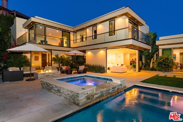 525 Bellagio Terrace Los Angeles, California Stunning Head on Ocean View Estate. Warm Contemporary custom home with extremely high end finishes was built in 2016 & is situated on a quiet cul-du-sac in prime Lower Bel Air. Very light and bright, all entertaining rooms open to large, private sunny yd w pool & spa. Outdoor seating w fire-pit and separate BBQ area. Perfect center hall floor plan features, high ceilings, gourmet eat-in kitchen w adjacent family/great room, dining room, office/den, media/theater room, 3 en-suite guest bedrooms plus maids, lavish master with huge closets & bath. Beautiful gardens complete with waterfall and surround sound throughout the property. This High tech smart home w security cameras, remote access of lights, etc also features gym, wine cellar and oversized 2 car garage. Absolutely turn-key.