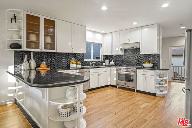 614 Flower Avenue Venice, California Just reduced 100K! 614 Flower Ave. Venice CA 90291. Two homes on a large 5,793 sq/ft lot. Beautifully renovated Craftsman, approx. 2,780 sq/ft, rooftop deck, private balcony off the master, wrap around front porch off sun room, wood floors throughout, open floor plan, light and bright. Freshly painted inside and out, floors refinished, new range, hood and landscaping. This unique property features the front house w/4 bedroom, 3 bath single family home with a chef's kitchen and entertainer's space. Great indoor/outdoor flow. Beautifully landscaped courtyard separates the main house and carriage house. A two bedroom, one bath private residence. Property backs to alley allowing parking in the front drive as well as the rear within the gate. This is a great opportunity to purchase a move-in, work from home or lease for additional income in this A+ location. Close proximity to Rose Avenue shops and restaurants. This home will not disappoint.