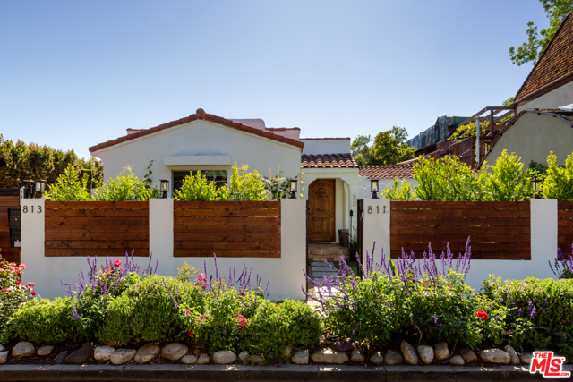 811 N SWEETZER Avenue West Hollywood, California The perfect 'in the city' hideaway. Fenced and gated. Convenient walk friendly West Hollywood location. Quintessential revival Spanish bungalow with arched entryway and hand-glazed tiles. This home has been completely remodeled with new wide plank hardwood floors, remodeled kitchen and bathroom. The kitchen is an open concept with a marble peninsula with a waterfall edge, new stainless-steel appliances, and plenty of cabinets. The Master bathroom has a separate tub and rain shower with double vanity. This home has an artificial turf front yard and a large outdoor patio for plenty of outdoor space. Edible garden with many different varieties of fruits and vegetables. Available Short term or long term. Listing price is Furnished, also available unfurnished. Comes with 1 off-street parking.