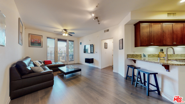 629 Traction Avenue 103 Los Angeles, California This charming one bedroom, one bath, corner unit condo is located in one of the most desirable, luxurious buildings in Downtown Los Angeles. This unique, corner unit floor plan, is only offered in 6 units with in complex. Features include: an open floor plan, wood flooring, floor to ceiling windows, central air/heat, and in unit washer/dryer. The kitchen has granite countertops and upgraded GE monogram appliances . Double-paned windows and heavy duty patio door provides a stress free environment. Being a southwest-facing unit, it receives plenty of natural sunlight. The 7 x11 private balcony has street access and is the only one-bedroom unit with a full balcony/patio in the entire complex. HOA amenities include includes water, trash, security, patio maintenance, guest parking, pool/hot tub/gym. Just moments from Little Tokyo, Metro Gold Line, freeways and top of the line restaurants and entertainment in DTLA. Includes one garage parking spot.