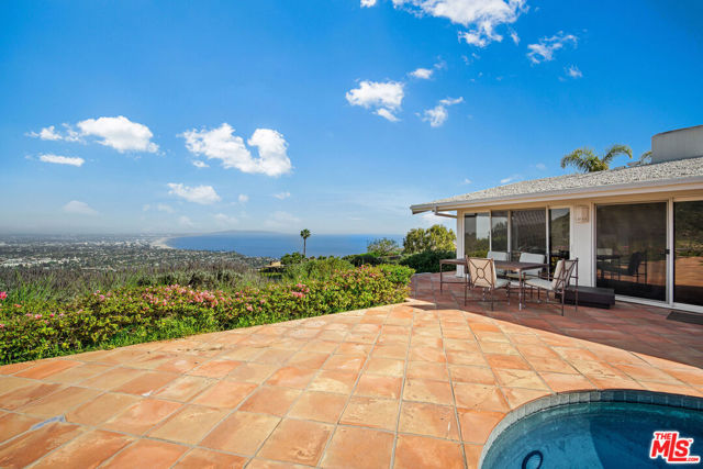 1354 Lachman Lane Pacific Palisades, California This stunning Upper Lachman home located in the extremely desirable Marquez Knolls is perched on a coveted street with an expansive 16,600 sqft lot. Experience panoramic ocean views From Catalina, Palos Verdes and the Queen's Necklace to Downtown LA. Bring your dreams to life by creating a stunning home, indoor/outdoor living space and pool on this pristine piece of land-there are endless possibilities! As the lighting changes throughout the day, enjoy the striking display of sunshine and spectacular sunsets. The current home features 3 bedrooms and 2 bathrooms with living spaces that overlook the breathtaking views. Close proximity to all the Palisades has to offer, including the luxury conveniences of the new Palisades Village and a short drive to the ocean