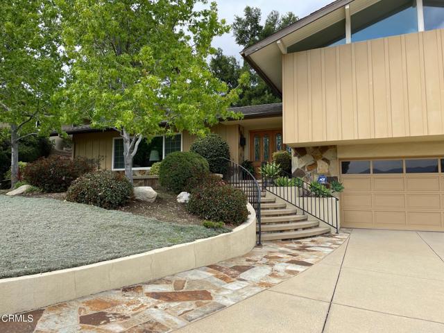 2743 Brierhaven Drive La Crescenta, California Do not miss this mint condition Pinecrest Wiley's WESTERNER Home. Our custom double oak doors with beautiful leaded glass inserts open to a formal entry with terrazzo tiled floor that leads to the 24' 9' x 13'8' formal living room, with natural lite from a large picture window and side sliding windows, looking out to the landscaped grounds. The adjacent dining room 14 x 9 has a picture window overlooking the gardens and patio. This spacious kitchen boasts newer Samsung refrigerator, Bosch dishwasher and GE double oven, overhead lighting with custom porcelain tiled counters and garden window. The breakfast bar joins the family room and kitchen with an additional breakfast table area, a gas fireplace with hearth and built-in bookcase. There is a newer intercom available throughout the house. Sliding glass doors lead to the patio and tiered backyard. Two bedrooms are up 6 stairs with high open beamed ceilings, fan lights and angled windows. The main suite is spacious with mountain view, room for a king-sized bed, triple dressers, chairs and has a full wall of wardrobe with built-in shelves. The main bathroom has double sinks with an exceptional plate glass mirror, privacy niche toilet and a unique walk-in tiled shower. Downstairs is a 16.6 x 12.9 multipurpose room (has been utilized as a fourth bedroom) with a deep walk-in closet, 3/4 bathroom and sliders out to the lower-level rear yard. Landscape and hardscape are beautifully appointed front and back. The approach from the front has sweeping entry stairs, the rear yard has shaped patio with accent walls and auto-sprinklers front and back. Easy to enjoy...welcome home!