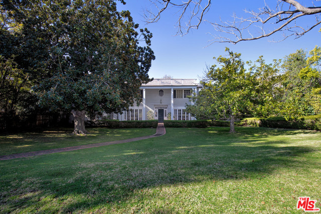 337 S Burlingame Avenue Los Angeles, California Stately 1949 Colonial set behind majestic, old growth trees on a sprawling, west facing lot in prime Brentwood Park. Situated between San Vicente and Sunset, this extraordinary property offers great privacy, yet is in close proximity to the Country Mart, the bike path and the shops and restaurants on San Vicente. Welcoming entry leads to well-detailed living room with radius bay window & fireplace, formal dining room and music room. Cozy den & family room each with fireplace overlook the pool and gardens. There are four bedrooms (two up and two down) all with en-suite bath, plus a powder room. Hardwood floors, crown mouldings, wainscoting, chair rail and other Traditional details add character and charm to this warm and inviting home. A rare opportunity to restore/remodel a timeless classic from a bygone era, or to build a magnificent estate in one of the Westside's most coveted locations. Available for the first time in 45 years!