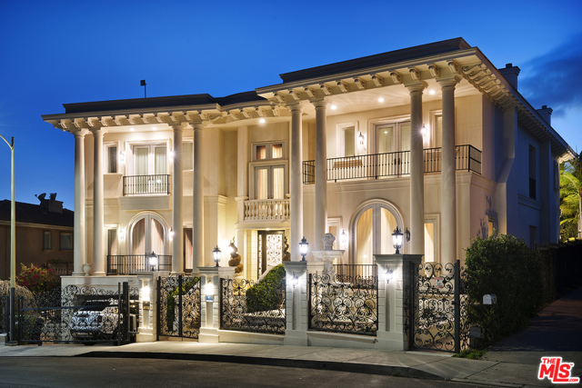 2229 Summitridge Drive Beverly Hills, California This Stunning Contemporary Mediterranean estate is behind gates in a prime location just outside exclusive Beverly Park and is complete with fabulous city and mountain views. Almost 10,000 square feet of custom construction, soaring ceilings and top of the line finishes and features. Dramatic grand entry and impressive foyer with an elegant staircase design. The gourmet kitchen features expansive center island/breakfast bar and imported Italian counter tops. The grand staircase leads to a gorgeous master suite with sitting area, dual designer marbled bath, and balcony. Features include 7 bedrooms, 10 baths, a unique formal ground floor ballroom, light filled formal living room, multiple entertainment areas, gym, sauna, elevator, beautiful marble, stone and wood floors, sparkling waterfalls, pool, spa, fire pit and a grassy yard. Designed to be a flawless meld of family living and grand entertaining in high style. A remarkable value for this square footage in such a prime location.