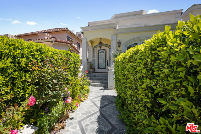 442 S Almont Drive Beverly Hills, California This palatial, Italian-inspired home situated in Beverly Hills is unique in its design, and prime in its location. This exceptionally spacious three story home with over 4600 square feet of living space boasts a beautiful formal dining room, living room with an elegant dome-shaped ceiling enhanced with custom designed crown moulding. The chef's kitchen includes custom built- in cabinetry and Viking appliances. The spiral staircase with a colourful beveled glass skylight , and a grand chandelier leads to the second floor bedrooms. The upper level includes a charming master suite complete with a fireplace, dual vanities, a sprawling walk-in closet, and a private balcony. The wood panelled elevator connects all three levels. This home is perfect for entertaining, with a large family room, a bar and a sparkling saltwater pool outback.