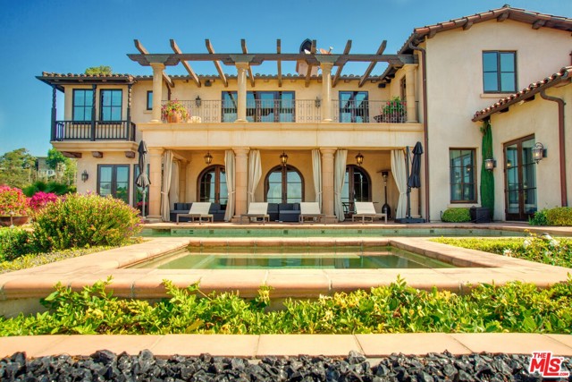 1111 Stradella Road Los Angeles, California Very charming Spanish Mediterranean, 6 bd, almost 7000 SF very private, totally gated with views of OCEAN AND CITY lights!! Sitting on almost 2 acres with a few flat pads ( possibility to build tennis court or extra grass yard) Beautiful entertaining area next to the pool with TV and dining, motor court for extra cars and second area for kids to play or drive bicycles.