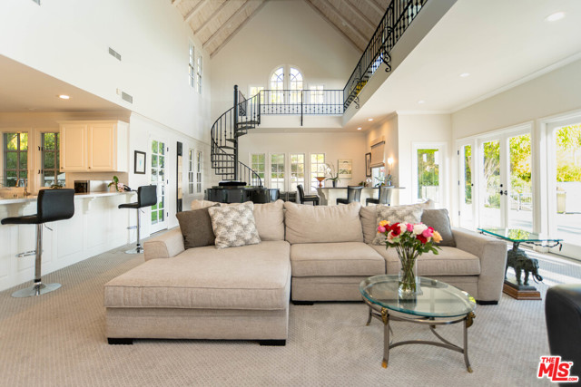 16660 Cumbre Verde Court Pacific Palisades, California Gorgeous, Country French style home w/ modern interior, located in the quiet Palisades Highlands. Boasting amazing ocean, coastline & mountain views w/ 6,863 SF of luxury living space, that can be expanded if desired, 6 bedrooms & 7 bathrooms. Dining room comfortably seats 20, sharing a dual sided fireplace w/ the enormous two-story family room. Walk-around bar for entertaining. Main level also offers a large formal living space & wood-paneled library/office. Plus a maids room, laundry room w/ separate access, & 3-car garage. Chefs kitchen offers a breakfast bar, breakfast area & huge center island w/ updated finishes. Upstairs, spacious master suite w/ fireplace & his & her closets. Exceptional views through the bay window of Queens Necklace, Santa Barbara & out to beaches of Santa Monica. At night, experience the twinkling lights of the city & planes from LAX. 31,228 SF lot includes pool and spa, w/ recently redone hardscape & huge shaded, grassy side yard w/ fruit trees.