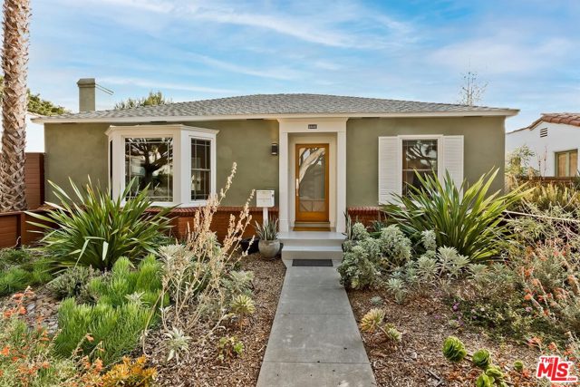 2232 21St Street Santa Monica, California On one of the best tree-lined streets in Sunset Park is where you'll find this classic California bungalow with seamlessly mixed period features and contemporary updates. A colorful native plant garden welcomes you into the light-filled living space with original crown molding, decorative fireplace, carved mantle and large bay window. From here enter in to the heart of this home - a thoughtfully updated cooks kitchen, where you'll enjoy entertaining with a custom walnut topped island, Thermador appliances, farmhouse sink, Caesarstone counters and eat-in dining area bathed in natural light. There are two bright and airy bedrooms and a fully remodeled modern bathroom complete with separate shower/tub and heated towel rack, allowing you to move right in. French doors lead right off the kitchen out to an expansive backyard which feels like your own private park, with multiple spaces for outdoor dining, relaxation and endless possibilities for expansion, a pool and to build an ADU. This peaceful and inviting house is perfectly located in close proximity to local parks, schools, weekend farmers market, shops and restaurants. You'll love where you live!