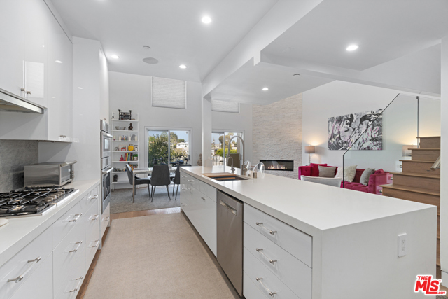 235 Main Street 224 Venice, California What you need to know about this wonderful property: Once in a rare occasion, a truly remarkable home comes to market- luxury living at the beach. This is that home. Meticulously renovated in 2019 from top to bottom, everything inside has been reinvented, re-crafted, and renewed with this tri-level 2- bedroom 2.5 bath condo. New kitchen with custom cabinets and custom breakfast nook with storage, new bathrooms including Toto toilets with bidets and tile floors, new 9" wide wood floors, custom built closets, LED ceiling lights, recessed baseboard molding and modernized sprinkler heads. Smart home integration including 60 smart switches, 6 zone Sonos speakers, smart doorbell, key less lock, alarm system and cameras throughout. Additional CAT 6 wiring on each floor for an ultra-high-speed network. Soaring 19 ceiling and custom-built glass staircase to the loft which hosts a media room with Dolby Digital surround system. A 160-sf private patio with an outdoor movie screen and fire pit round out this luxurious condo. // What our sellers love most: The extensive remodel created an openness unlike other units. A luxurious oasis that is both comfortable and elegant. Very private and quiet tri-level condo; a stones throw to the beach and walking distance to exceptional dining. // This homes personality is: Open, yet inviting and ready to host a dinner party.