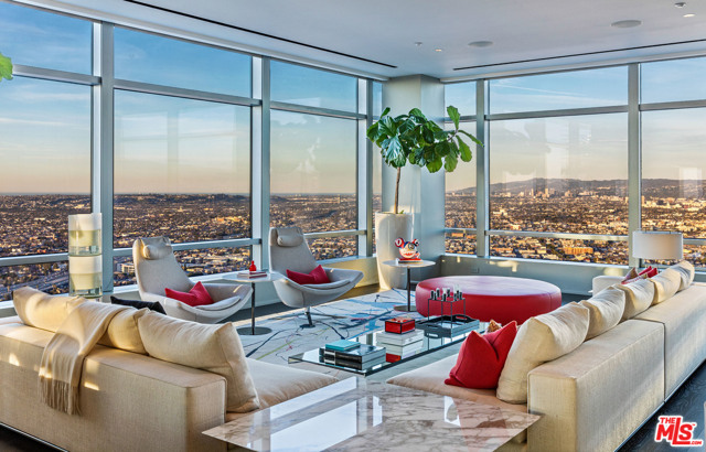 900 W Olympic Boulevard 51A Los Angeles, California The crown jewel of Downtown Los Angeles, 51A is a duplex penthouse atop The Ritz-Carlton Residences at L.A. Live and was masterfully custom-designed by Moore Ruble Yudell. With 6,590 square feet of fully-furnished interiors, this remarkable residence in the sky affords you uninterrupted jetliner views of downtown and the Los Angeles skyline, access to The Ritz-Carlton's gold standard of service and has you an elevator ride away from citys premier sports and entertainment attractions. The sleek, flush design is ideal for showcasing artwork and creates a dynamic visual experience throughout. A second level en-suite guest bedroom is joined by a master wing featuring a lounge room, spa-like bath, full bar and closets reminiscent of a high-end boutique. In addition to a world-class restaurant, residential sky lobby and private heated rooftop pool terrace, all residents can seek out the nearby STAPLES Center, Microsoft Theatre, L.A. LIVE and The GRAMMY Museum.