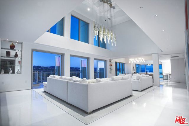 10727 WILSHIRE Boulevard PH4 Los Angeles, California Finest and Most Unique Penthouse on Wilshire Boulevard. This Remington penthouse of approx. 6,000 sq ft interior has perhaps the largest outdoor terrace on Wilshire with approx. 3,000 additional sq ft, thus creating one of the most impressive penthouses in Los Angeles. Stupendous views span from the ocean to the Hollywood Hills. Just remodeled, this two-story unit features a large living room with floor to ceiling windows, a formal dining area, gourmet kitchen, wine cellar, private in unit elevator to the second floor, plus two bedroom suites and large master suite. This unit offers direct elevator access to a private foyer from the buildings lobby.