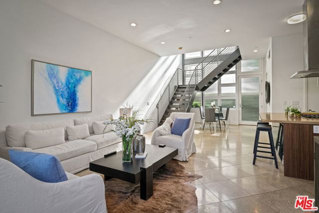 1524 11th Street D Santa Monica, California Live the quintessential Santa Monica lifestyle in this modern and elegant loft-style townhome featuring a 3-story wall of privacy windows, providing a ton of natural light, and 3 private outdoor spaces. Built in 2008 and located just blocks away from Downtown Santa Monica and the beach. The ground level features high ceilings and and open floor plan with the kitchen, dining, and living space flowing seamlessly together with sliding glass doors leading out to a private patio, perfect for alfresco dining. The designer kitchen boasts subway tile backsplash, stainless steel appliances, and a center island with stove and vented hood. A powder room and stackable laundry closet complete the ground floor. The 2nd and 3rd floors each feature private bedrooms and bathrooms, plenty of closet space, and north-facing balconies. Additional amenities include 2 subterranean parking spaces, a private 8 x 9 storage unit, central heat & A/C, and a secure gated entry. Capitalize on the fantastic walkability of this location - steps away from some of the best shopping, restaurants, & entertainment that Santa Monica has to offer. Property website: www.152411stD.com.