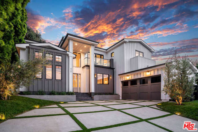 920 Las Pulgas Road Pacific Palisades, California Perched on a knoll this custom 5 bd & 5.5 bth 4,272 sq ft new modern farmhouse welcomes you with soaring ceilings, open floor plan & an abundance of natural light. Modern luxury blends w/high-end designer finishes to create this retreat in the PP. 2 story foyer leads your guests to the formal dining rm w/ built-in cabinets & custom wall coverings. Enjoy drinks by the custom, floor to ceiling fp in the living rm w/ 20 ft coffered ceiling. Family rm has fp & large folding doors which open up to a private backyard w/ built in bench, fire pit & bbq to create an indoor/outdoor environment for perfect SoCal evenings. Wine rm makes the perfect backdrop as you pass to the kitchen w/ custom oak cabinetry, high-end fixtures and Dacor apps/ breakfast area. Guest bedrm, office w/ separate entrance & laundry rm complete the 1st floor. Upstairs has 4 bedrms, all with en-suite bathrms. Master suite is the ultimate retreat w/ romantic fp and folding doors opening to the balcony overlooking the yard.