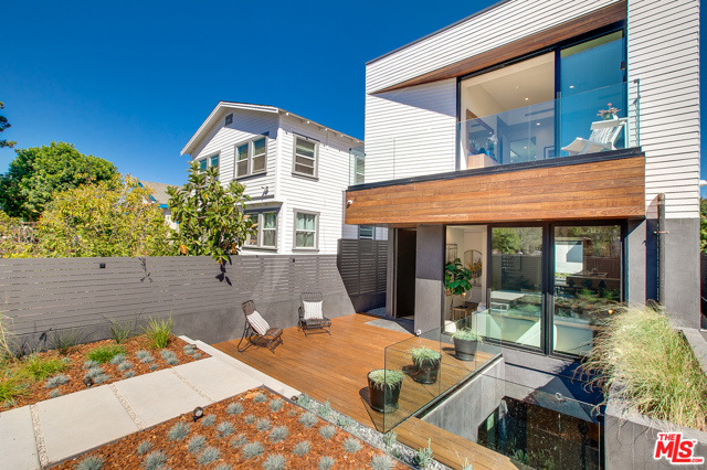 112 N Paloma Avenue Venice, California This truly creative and trend setting newly constructed home, is one of Venice's most spectacular residences, encompassing the best design, location and size. Situated on a charming walk street one block from the beach, this exceptional home boasts 5 bedrooms and 4.5 baths, totaling 3937 sqft. Oversized windows and innovative design, showcase the contemporary finishes and fittings, which include, custom cabinetry, Meile appliances, smart home technology and spectacular bespoke bathrooms filled with Calcutta marble. Additional features include an oversized entertainment floor, consisting of media area, bar, patio, and wine room, there are multiple outside areas, including an oversized rooftop deck, offering epic 360 views of the city, ocean and mountains, finally there is a two car garage. This one of a kind home offers modern, spacious, flexible living, steps from all that Venice has to offer.
