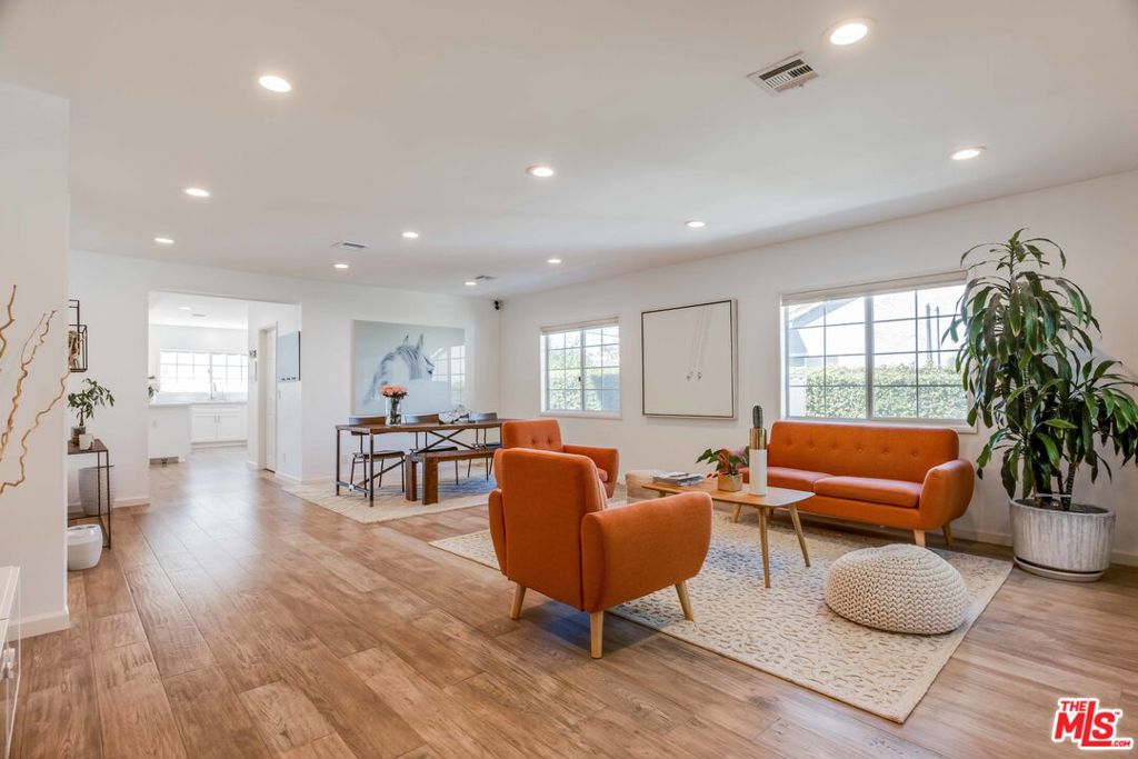 4903 Newcastle Avenue Encino, California This absolutely stunning and completely remodeled residence is highlighted with gleaming wood, open living spaces, loads of natural light and designer touches throughout! Nearly every surface has been recently updated to include all new baths and gorgeous chef's kitchen encompassing stainless Viking appliances, grand breakfast bar with drop lighting, custom cabinetry and quartz counters. Opening from the kitchen is the expansive family room with romantic central fireplace along with adjacent formal dining and over sized living room, all highlighted with recessed LED lighting and beautiful picture windows. Encompassing separate office with library and four bedrooms that include ultra-private master suite with sitting area, customized walk-in and wardrobe closets as well as luxurious spa styled bath highlighted by its dual sink vanity, free standing soaking tub, seamless glass shower and separate commode. Step out into the peaceful rear yard adorned with entertainers patio retreat, manicured lawn and wonderfully updated landscape. Garage has been converted into a 400 sq.ft permitted ADU with kitchenet and full bathroom. A truly sensational home, located on a wonderful tree lined street within a short stroll to Blvd shops and restaurants. A rare opportunity to own this beautiful property south of the Blvd.