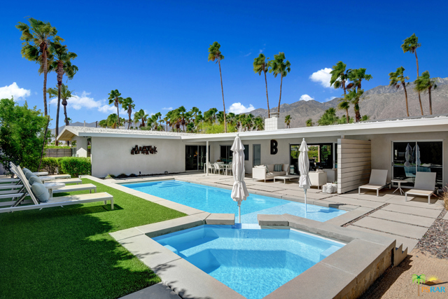 208 N Michelle Road Palm Springs, California Stunning mid century renovation in Sunrise Park with outstanding views and every possible amenity. A more substantial house with a modern tonal environment that offers multiple communal spaces both indoors and out. An incredible front courtyard with concrete sunscreen, built-in fireplace table BBQ that surrounded by gracious seating areas create a amazing area to relax and entertain enjoying the beautiful sunsets and mountain views. Stacking glass slider wall connects the interior and exterior to further maximize the experience. A spacious home where you will find two primary bedroom suites and 2 guest bedrooms for perfect separation. Chefs kitchen complete with Wolf and Viking appliances connected to a generous great room with fireplace . Back outside opposite the courtyard you will find covered patios and beautiful pool and spa fire features and a raised lounge area to enhance the gorgeous views. In addition upgraded dual pane windows, automated blinds, and Solar to help with energy efficiency. A truly special home that must be viewed to appreciate the experience and all that it has to offer.
