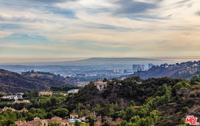 13170 Mulholland Drive Beverly Hills, California Prime development offering above Mulholland and overlooking Beverly Park with sweeping, unobstructed views from Beverly Hills to the ocean. Situated up a private driveway, this approximately 3/4 acre+ pinnacle property exhibits remarkable potential to build an unparalleled view estate in 90210.
