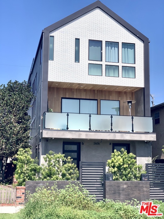 2606 S BARRINGTON Avenue B Los Angeles, California This luxury townhouse-style residence is one of just 2 units of a BRAND-NEW contemporary duplex in the heart of the Westside. The 2nd floor open concept living space features high ceilings & a large covered patio with BBQ for outdoor entertaining, & lots of storage. Upstairs, the master bedroom has high ceilings, west-facing views, huge closets & a gorgeous en-suite bathroom. The 2 other bedrooms share a large bathroom Jack-and-Jill style. Downstairs has an entry area, laundry room, & bonus space that could serve as an office, workshop/art studio or storage for bikes etc. The unit has a private 2 car garage with alley access. Double glazed windows block out city sounds, while the excellent urban location is walking distance to Whole Foods, Starbucks, the Expo Line, restaurants and much more. Alarm system with exterior cameras and smart home system. VACANT SO EASY TO SEE SAFELY. Furnished or unfurnished, short or long term.