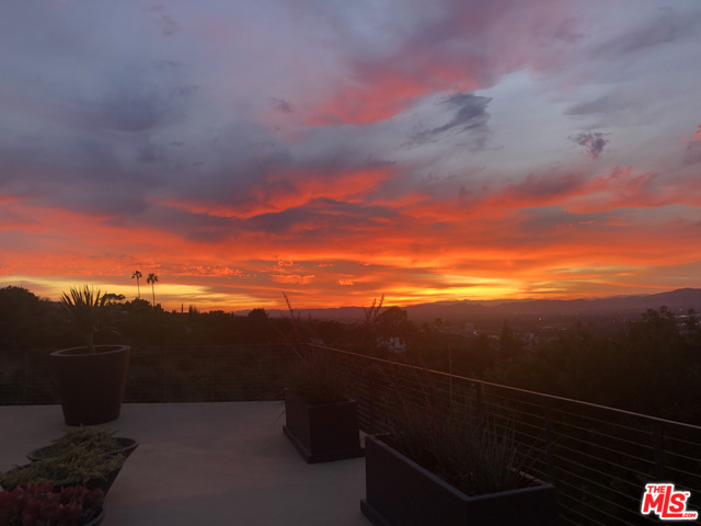 3337 Beverly Ranch Road Beverly Hills, California Stunning and explosive panoramic views of the city, mountains, and beyond define this prime BHPO home by AIA award-winning architect James Schmidt. Situated behind gates on a private ridge, this published residence was designed to maximize transparency and compliment the surrounding landscape. Sunrises and sunsets are magical and evoke a sense of peace and tranquility. Walls of glass surround every room, showcasing the breath-taking views that allow you to float above the city below. With a luxury feel and minimalist aesthetic, the floorplan is built to facilitate entertaining and comfortable living. Architectural and design features include pivoting glass entry door, sculptural staircase, moving art wall, expansive decks, salt-water pool and spa. Custom Arclinea kitchen features Subzero, Miele, and Wolf appliances. Primary suite features a large walk-in closet and well- appointed bath. Three additional bedrooms w en-suite bathrooms, home theater, office and gym complete this remarkable home. True privacy and tranquility in one of LA's most desirable locations.