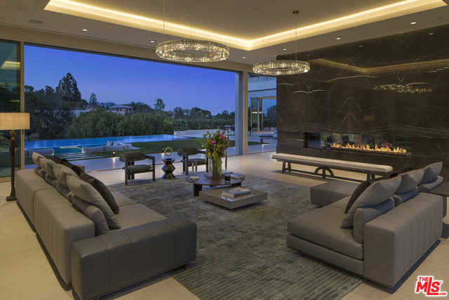 642 PERUGIA Way Los Angeles, California Now priced to sell. Reduced over $7.2 Million representing an incredible Value. One-of-a-kind Contemporary masterpiece designed by Quinn architects in prime lower Bel Air. Approx. 1-acre promontory overlooking the Bel Air Golf Course and dramatic city views. Spectacular 40 sky-lit atrium entry with floating staircase, great lounge, bar lounge, family room and dining room open to completely seamless coordinating outdoor entertaining spaces. The incredible master suite encompasses approx. 2,100 square feet with custom dual closets, breathtaking oversized Italian marble bath with dual areas plus massive terrace with spa, lounge area with fire pit and views. The superbly designed grounds include a 65 infinity pool and expansive grassy yard. 642 Perugia Way is a magnificent blend of contemporary style and finishes with masterful European design influences which are perfect for today's lifestyle.