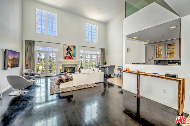 1040 4Th Street 405 Santa Monica, California The Dorchester House is one of Santa Monica's best condominium residences. AAA prime location 4 blocks from the beach and a short walk to the 3rd Street Promenade. As you enter this updated, front facing, top floor unit you are met with an abundance of natural light from the the 18ft double height windows and french doors that open to one of many outdoor spaces of your two story home. Sumptuous first floor master bedroom with oversized custom walk in closet and large spa bathroom. The stylish chef's kitchen with top of the line appliances opens to the dining area and living room. On the second floor is a loft as well as a third bedroom with ensuite bath and a separate laundry room. Not to be missed is the massive, exclusive, and very private rooftop deck that is the epitome of luxury lounging. Extremely spacious with boasting a variety of luxury features, two extra storage spaces, and 3 side by side parking spaces this is one not to be missed.