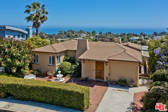 16576 Chattanooga Place Pacific Palisades, California On the market for the first time in over 50 years, this panoramic ocean view property poses an incredible opportunity to remodel or build new. Entering on the top level, guests are welcomed by the mesmerizing views from the front door and nearly every room in the current home. The top-level features a living room, two bedrooms, a kitchen, and a dining room leading out to an impressive deck that seemingly floats out towards the ocean. A family room, bar, bedroom, and bathroom round out the lower level, leading to the lower deck with in-ground spa and yard. Just minutes from the Village, renowned beaches and trails, and the rest of the Westside, this is a rare opportunity to create a stunning dream home.