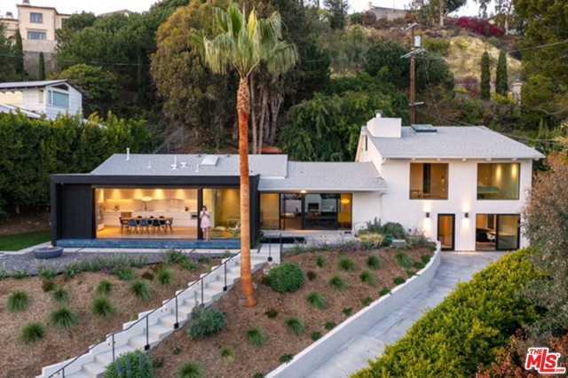 1312 Monument Street Pacific Palisades, California Located just above the Village, this stunning Architectural home with permitted ADU, is set up a drive on a 14,765sq ft. lot. With ocean views to Catalina, this impeccably bespoke-designed home has top-of-the-line finishes and craftsmanship. This 5 beds, 4 baths, 2 kitchen offers a private indoor-outdoor coastal experience. The beautifully designed front yard with a water feature showcases the main house and entry with stunning black Sho Sugi Ban wood. A gorgeous kitchen/living area links the front and back yards with views to the ocean. There are Gaggenau appliances throughout the main kitchen. The bathrooms feature custom marble integrated sinks, Heath ceramics tile, and DXV amenities. Natural Wide-plank floors run throughout the main home. The Smart Home is wired for low-voltage, Sonos surround system, Security system, Climate control, and Apple TV. The ADU with bed, bath, and a full kitchenette with Gaggenau appliances is perfect for guests, live-in nanny, or home office. Expansive backyard complete with fireplace, multipurpose play area, a gorgeous secret trail with a bench seat looking over the Palisades, and fruit trees. There is also room for a pool, see renderings. This one-of-a-kind residence is designed around the art of entertaining, work from home, or spending time with family and friends.