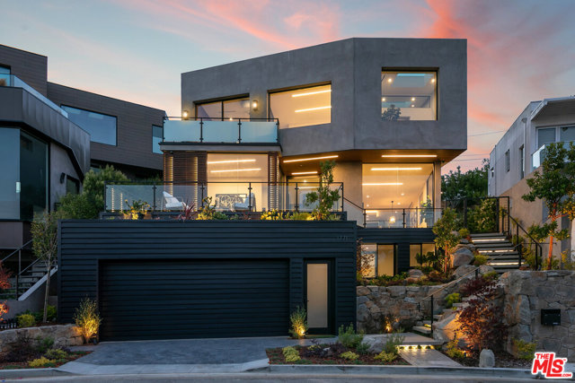 1771 Sunset Avenue Santa Monica, California A true champion of modern architectural design that melds luxury, style, and sustainability, 1771 Sunset Ave is one of the newest homes in Santa Monica. Earthy textures and clean lines give life to each space as oversized picture windows, skylights, and the central lofty atrium bring in light, fresh air, and greenery to each floor. Relax on the outdoor decks and enjoy the views, or float in the infinity pool and jacuzzi. Modern luxuries include refrigerated wine room, premium Sonos surround sound, custom lighting, sculptural fixtures, and security system. Reminiscent of a modern luxury hotel, the spacious and airy master suite features a gas fireplace, dual expansive walk-in closet, and sumptuous spa-like finishes contrasting the soaking tub, steam shower, and oversized vanity. The basement level includes a media/multi purpose room w/ bar, and guest suite. The Sunset Park neighborhood of Santa Monica is minutes to the beach and centrally located with easy access to all the best of the Westside.