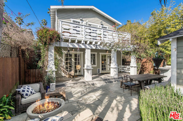 820 Milwood Avenue Venice, California Beautifully reimagined California craftsman home built in 2001. This private and gated magical gem offers 3 bedrooms, 2 baths plus office/fitness/creative/4th bedroom flex space, holding true to authentic period design details while seamlessly integrating all modern conveniences. Features include Miele, Sub Zero, c.1955 O'Keefe Merritt stove, Carrara marble countertops, 2 fireplaces, wainscoting, period-style built-ins, home audio system, central air. The entire second floor reveals the fabulous and romantic primary bedroom suite with vaulted wood ceiling, fireplace, lounge deck, a generous walk-in closet and spacious bathroom with claw foot tub and separate shower. Relax or play in your private and dreamy back yard complete with a large stone patio, built-in barbeque and fire pit. Fully finished and climate-controlled 2-car detached garage plus extra parking. Highly desirable location on one of the estate streets of Venice and ideally located just two blocks from famed Abbot Kinney Blvd, restaurants, shopping. Walk/bike to the beach and the beautiful Pacific Ocean!