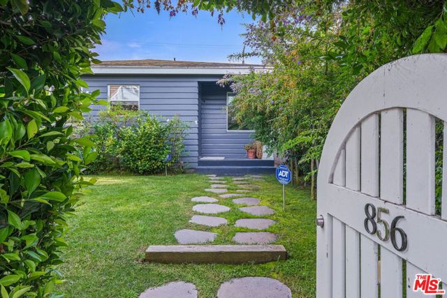 856 Marco Place Venice, California Live inside a secret garden. This light & airy three bedroom, 2 bathroom 1950s home is on one of Venices premiere Walk Streets. This private & serene section of Venice allows only foot traffic (no cars) on a sweet little sidewalk between homes. The front yards become gardens for outdoor dining, watching the kids play and enjoy wine & sunsets with neighbors. There are sparkling oak hardwood floors throughout this home. The kitchen has been tastefully remodeled with stone countertops & wood cabinetry. The bathrooms are freshly tiled with midcentury accents. At the back of the property is a beautifully hardscaped garden with mature landscaping and a 2 car garage. The location is perfect, just 3 blocks to world famous Abbot Kinney coffee shops & eclectic boutiques & an easy bike to Venice Beach.