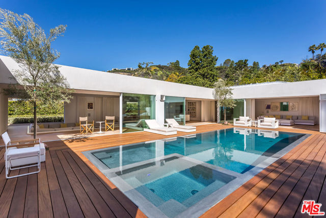 1106 N Hillcrest Road Beverly Hills, California Located on the most sought-after street in Los Angeles, "Billionaire's Row," this spectacularly crafted contemporary estate offers city and ocean views and exudes quality and refinement. A stunning zero-edge pool, substantial Ipe outdoor decking, bespoke Poliform fixtures and finishes, subtle indoor LED lighting, and lush and tranquil landscaping complete this impressive single story estate. With an open floor plan and floor-to-ceiling glass doors, the home boasts exceptional indoor-outdoor living. Secure and private, this is a unique opportunity for the most discerning owner.