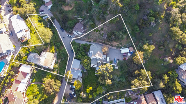6851 CAHUENGA PARK Trail Los Angeles, California Rare opportunity to develop over 1 acre view property in the Hollywood Hills. Unlike other times this house was listed, now all 12 APN's will be included all for one price of $7,000,000! There is the possibility to build up to 9 separate homes. The 3 homes that exist on the property can easily be restored to their true Hollywood Glamour! This is a developer's dream!