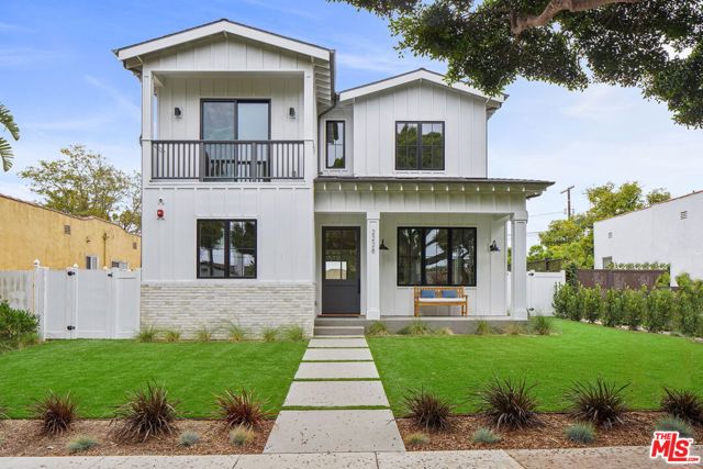 2228 Cloverfield Boulevard Santa Monica, California On an enchanting tree-lined street in beloved Sunset Park, sits this fabulous, newly built Cape Cod farmhouse. Enter to a bright and open floor plan, beautifully accented by grand windows, fireplace, contemporary light fixtures, wood beam ceiling accents and oversized archways for a seamless flow through all spaces. An inviting casual living space boasts sleek built-ins, gorgeous fireplace and sliding glass doors for coveted indoor/outdoor living. A chefs dream, center island, subway tile backsplash, breakfast nook, top-of-the-line appliances and butlers pantry. Master suite features a vaulted ceiling, fireplace, private balcony, walk-in closet, and decadent marble bath with dual vanities, soaker tub and luxurious glass shower. Additional amenities include a rare ADU with kitchen & separate bedroom, formal dining room, generous guest rooms, sumptuous baths, laundry room, garage and more. Move-in today and live in the heart of Santa Monica, only minutes Whole Foods and the beach.