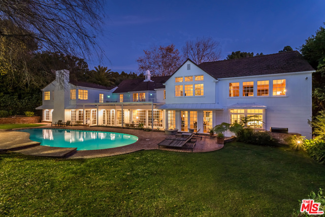 1027 Summit Drive Beverly Hills, California This beautiful, Traditional Tennis Court Estate with tranquil backyard is located in the heart of Beverly Hills. The circular driveway leads to a 2-story entry with a grand staircase. The home's spacious living room opens to the formal dining room and an inviting backyard with a pool and tennis court. A large family room with bar and fireplace, gorgeous kitchen, master suite with his and hers baths and closets, office, 3 additional bedrooms, staff's room and a bonus room make this the most comfortable home for sharing with the family, hosting and entertaining. A unique opportunity to own a property in prime Beverly Hills, north of Sunset and minutes away from Rodeo Drive and award winning hotels and restaurants. This gorgeous property with over 29,900 square feet of land is in the most sought after and desirable of locations.