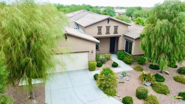 38899 Corte Ancera Indio, California 55+ Sun City Shadow Hills/Del Webb, Californian Model. 3 bdrms/3 Bath. Full den/office. Extra large garage for full two cars and Golf Cart. This very well maintained home has nearly 2800 Square feet of living space. Custom ceramic tile throughout. Custom window coverings inside AND out, with energy conservation in mind. This home has a large salt water pebble tec pool and spa, offering Solar heat along with gas heating! Currently offered Unfurnished, furnishings are available outside of escrow. Large master retreat has very generous walk in closet, separate personal vanities, soaking tub, large spa sized shower and "snooze" room used currently as home gym! Gourmet kitchen offers large "walk-in" Pantry along with two wine chillers. Large laundry room with just off garage entrance to the kitchen/pantry. Great separation of guest rooms and two HVAC zones. Center courtyard off kitchen brings the outside in! This home is wrapped in outdoor and indoor entertaining spaces!