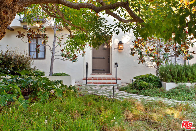 1607 CARLYLE Avenue Santa Monica, California Situated on one of the most idyllic streets north of Montana Avenue, this stunning Spanish home has tremendous curb appeal. Set back from the street on a corner lot, this home exudes character and authentic charm. Enter through the formal entry into the spectacular living room with wood floors, beautiful picture windows, dramatic vaulted ceilings, and a wood-burning fireplace. The beautiful and gracious family room opens to the entertainers patio and spacious yard that is perfect for everyones enjoyment. The dining room has a romantic sensibility and boasts ample space for formal occasions or perfect as an intimate setting. The upstairs features a sensational primary suite with a sitting area, dressing room, built-ins, and an en-suite bathroom. Two additional bedrooms are also located upstairs. The grounds are private with mature landscaping, fruit trees, a fire pit, uplighting, and a gated back yard.