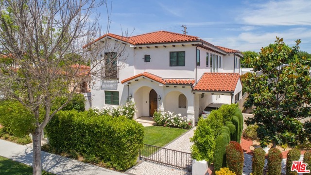 244 S CLARK Drive Beverly Hills, California Almost brand new exceptional gated Mediterranean Villa with custom high-end finishes. Exquisite formal living room and dining room with adjacent large butler's area fully equipped with custom-made cabinetry and wine cellar. Amazing open floor plan-perfect for entertaining-Family room with fireplace and Grand Kitchen with large center island, French doors to the entertainers' backyard with a sparkling pool & spa. Chef's gourmet kitchen with extravagant custom designed finishes & high-end professional appliances & walk-in pantry. First floor also features an office with full bathroom/5th bedroom, a separate powder room. The second-floor features 4 bedroom suites including a luxurious master suite w/ an incredible walk-in closet, fireplace & a spa-like master bath, relaxing bath tub & a spacious balcony. Specious laundry room w/ side by side washer & dryer, sink and plentiful cabinetry also on the second level. Great quiet street, Walking distance to Rodeo Drive.