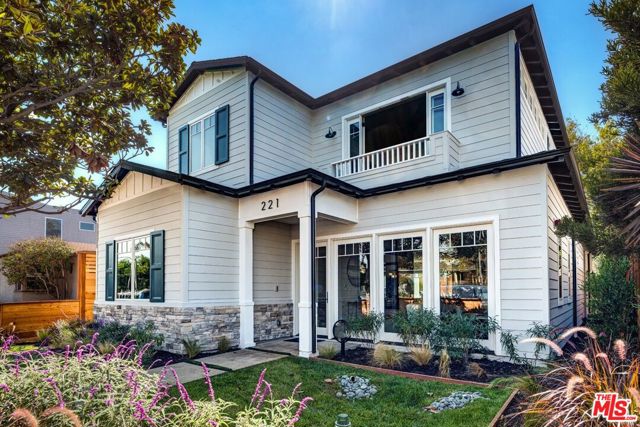 221 Ruth Avenue Venice, California Built by Thomas James Homes, this brand new home has been professionally designed, hand crafted to fit your needs, and comes with a full 10 year new home construction warranty. Walking distance from the Venice boardwalk, this four bedroom, four bath farmhouse enhances the neighborhood with a charming display of gray siding, teal shutters, and white windows and trim. A covered front porch with glass door welcomes you into the entry, where youll find a coat closet, bath with walk in shower and bedroom with walk in closet, perfect for overnight guests or working from home. Entertain in the expansive great room, which boasts gorgeous oversized windows, or host dinner parties for loved ones in the formal dining room. Prepare gourmet meals in the kitchen, which includes a walk in pantry and island with bar seating for casual meals. Relax in the family room, which has a cozy gas fireplace and sliding doors to the covered patio, as well as direct access to the two car garage. Ascend the stairs to find a laundry room with sink, linen closet, and two secondary bedrooms with en suite baths. Unwind in the luxurious grand suite which is host to French doors to the Juliet balcony and a pocket door to the spa like bath, complete with dual sink vanity, freestanding tub, walk in shower and closet filled with natural light.