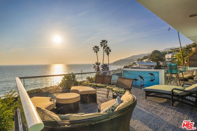 17737 PORTO MARINA Way Pacific Palisades, California Welcome to Villa Mimosa, a one-of-a-kind estate reminiscent of the Amalfi Coast in coveted Castellammare. Feel as if you are in Italy as you approach the home through winding roads and are led to the estate w/incredible ocean views. Grand picture windows & glass accordion doors allow for a seamless indoor/outdoor feel, bringing the ocean to you. Elegant kitchen w/breakfast bar, extensive wood cabinetry & ss appliances. Serene master w/fireplace, sliding glass doors to a large deck & bath w/tub, oversized window overlooking white water views. An entertainer's dream, the home boasts multiple outdoor areas. Features 1 bed/1 bath guest unit w/separate entrance (Approx 919SF not included in living SF) & recently updated. Move-in today & relish your coveted Pacific Palisades location, moments from Palisades Village, & steps from an easy access pedestrian bridge to the white sandy beach. This home w/Malibu tiles, brick fireplace, wood & granite accents, will revive your memories of Italy.