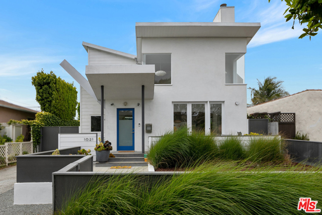 1021 Pine Street Santa Monica, California Fresh, contemporary Architectural home on a tree-lined street close to everything Santa Monica has to offer. The double butterfly roof sets this home apart and invites you through the front yard to the large porch. Designed with great attention to detail, this home features 14 clerestory windows illuminating the interior with natural light, wood floors adding warmth, built-in custom cabinetry, and an open floor plan that flows from living to dining to the kitchen. French doors open from the front porch to the living room with two-story ceilings and fireplace. The kitchen has a breakfast bar, tons of storage, and high-end appliances. The main floor includes the primary suite with a spa-like ensuite bathroom in a relaxing blue hue and it opens to the rear yard offering fruit trees and a detached garage. The good-sized second ensuite bedroom is also on the main floor. Upstairs youll find the third ensuite bedroom, a large airy loft family room, laundry room, office space, and a spacious deck with gas BBQ hookup and mountain views. This happy and bright home is in a great neighborhood with easy access to the beach, local restaurants, Gelsons, Whole Foods, coffee shops and all of the Santa Monica local favorites!