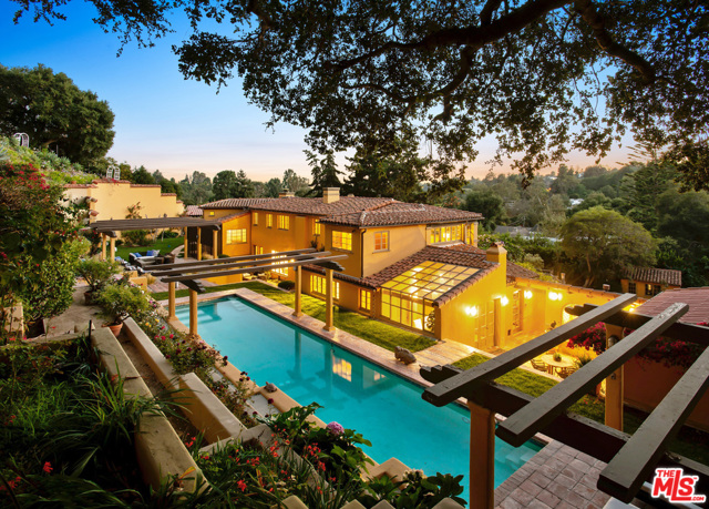 1744 Reedvale Lane Los Angeles, California Spectacular grounds, timeless style, and exquisite design, this Lower Mandeville Villa is in a class of its own. Tucked away behind the gates of a picturesque tree-lined driveway at the end of a cul-de-sac, this beautifully updated 1929 John Byers Estate feels like its worlds away. Surrounded by stunning mountain and canyon views, romantic rose gardens, and majestic fountains, this completely secluded 5 bed, 5 bath home is ideally situated off of the 2nd block of lower Mandeville Canyon. Designed to celebrate the quintessential Southern California lifestyle, the home's interiors gracefully open to the outdoors, filling them with natural light & ocean air. This enchanting estate, situated on nearly 1-acre, offers timeless charm, celebrates indoor/outdoor living, and ensures total privacy, a true sanctuary in the city. Additional amenities include; 55 ft swimmers pool, wine cellar, and writer's room/art studio with Northern light exposure. Truly a special home.