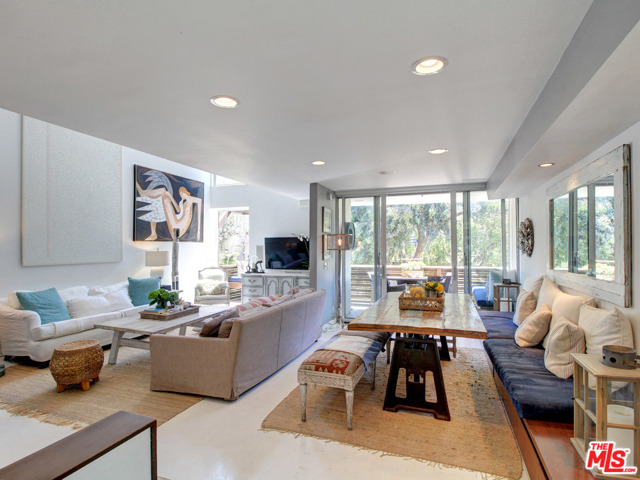 29 28Th Avenue 101 Venice, California This immaculate, Venice Beach town house is located on an iconic walk street, a block from world famous Venice Beach. At just over 2,000 square feet, the home features three bedrooms, three and a half baths and feels like a sprawling single family home. Modern design, floor to ceiling glass doors, state of the art appliances, radiant floor heating, a spacious ground floor terrace (with an outdoor shower) and two parking spaces are just some of the luxuries that await you. The breathtaking roof-deck, with mountain and panoramic views completes this breathtaking property. This is California beach living at its finest!