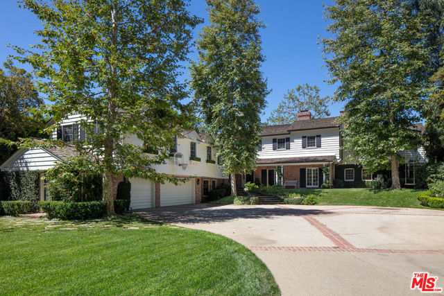 355 N Saltair Avenue Los Angeles, California Enter through tall private gates past a huge front lawn to this sprawling remodeled 1930's East Coast Traditional estate sited on a nearly all flat 28,000 Sq Ft "rim" lot with dramatic views in a desirable north of Sunset Brentwood locale. Living room with tall French doors and fireplace, warm paneled library/den & beautiful formal dining room with views, a real cook's kitchen with family dining, adjacent family room with fireplace and French doors. Three family bedroom suites complete the downstairs. The 2nd floor offers a sumptuous owner's suite with fireplace and French doors to the view, two elegant bathrooms and dual offices/gym. Two additional bedroom suites share the upstairs with a huge family/media room. Enormous front yard and lovely rear garden with pool, spa, outdoor fireplace overlooking canyon and ocean views. Located in close proximity to shopping and the city's top schools. This extraordinary home has it all.