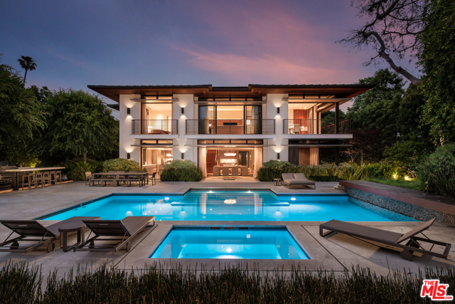 1303 PARK Way Beverly Hills, California Nestled on a tree lined street, this stunning architectural offers the finest caliber of living in a world-class location, moments from the finest shopping, dining and leisure the city has to offer. Custom built with the finest materials, features include smart home technology, home cinema and private elevator with an abundance of natural light throughout. Walls of glass in the living and dining rooms provide views of the lush and mature gardens, with an effortless flow into the beautiful chef's kitchen complete with professional appliances. The master suite provides the ultimate escape, with a cosy sitting room and office with garden views. Beautiful dual vanities, a soaking tub and walk in closet make up the master bath. Outside, resort-like grounds feature verdant landscaping, beautiful covered pergola with fireplace and sparkling pool and spa. The recipient of a 2015 Beverly Hills Single Family Residential Design Award, this property is the crown jewel of the Beverly Hills Flats.