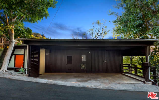 7912 WILLOW GLEN Road Los Angeles, California Mid-century Modern jewel in the hills! Designer renovation retaining original architectural charm reminiscent of the Case Study homes. Frosted glass walls surround the entry bringing you to an open concept living space. Tongue and groove wood planks wrap the angled wall to form high ceilings. Post and beams and walls of glass run the entire length of the South facing facade. Each room opens to a generous deck and expansive views letting in abundant natural light! Take in nature yet still conveniently located near movie studios, upscale shopping, dining, theaters, entertainment as well as hiking trails and parks. Too many upgrades to list including a completely remodeled Euro-style kitchen and skylit bathroom - all accented by high-end Anzzi fixtures and designer lighting. Glass tile accentuates the retro fireplace while original cone light fixtures and louvered glass retain those vintage touches of mid-century charm that make this home truly unique.