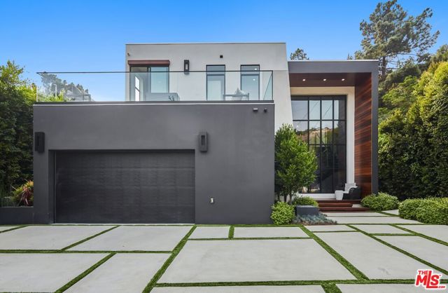 1849 Coldwater Canyon Drive Beverly Hills, California This newly constructed, private and gated estate is the pinnacle of modern design infused w/style and sophistication. Set in Coldwater Canyon just minutes from Rodeo Drive and the best dining and entertainment Beverly Hills has to offer. A culmination of the rarest, most unique materials and finishes sourced from around the globe w/top of the line luxury appliances and amenities throughout. A seamless indoor/outdoor open floor plan provides for the quintessential Southern California lifestyle. An entertainer's paradise, the estate is complete with a large patio, pool, spa, outdoor living room w/ fireplace, outdoor kitchen with BBQ and fire pit lounge area above the pool. This is a once in a lifetime opportunity to own a magnificent piece modern luxury. Live among the stars and titans of industry in the most coveted zip code in the world.